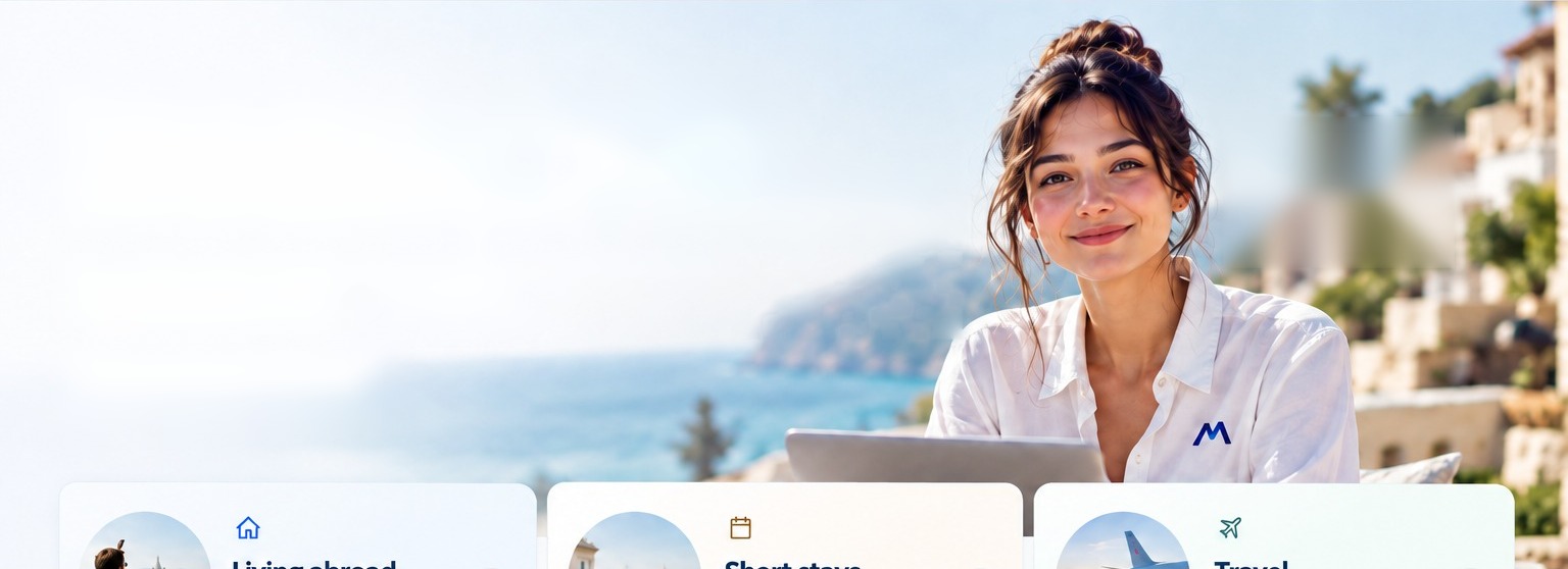 Mira, the ExpatMedicare adviser, smiling on a terrace above the sea
